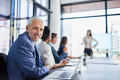 Buy stock photo Happy CEO, boss or chairman looking confident in a team meeting at work. Portrait of a proud employee with colleagues as they discuss new innovative plans and strategy in a corporate office
