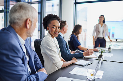 Buy stock photo Portrait of a businesswoman sitting in a boardroom presentation with colleagues