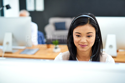 Buy stock photo Callcenter, smile and Asian woman at computer in customer support, help desk or telemarketing office. Headset, online consultation and client service agent in workplace for crm, advice or phone call