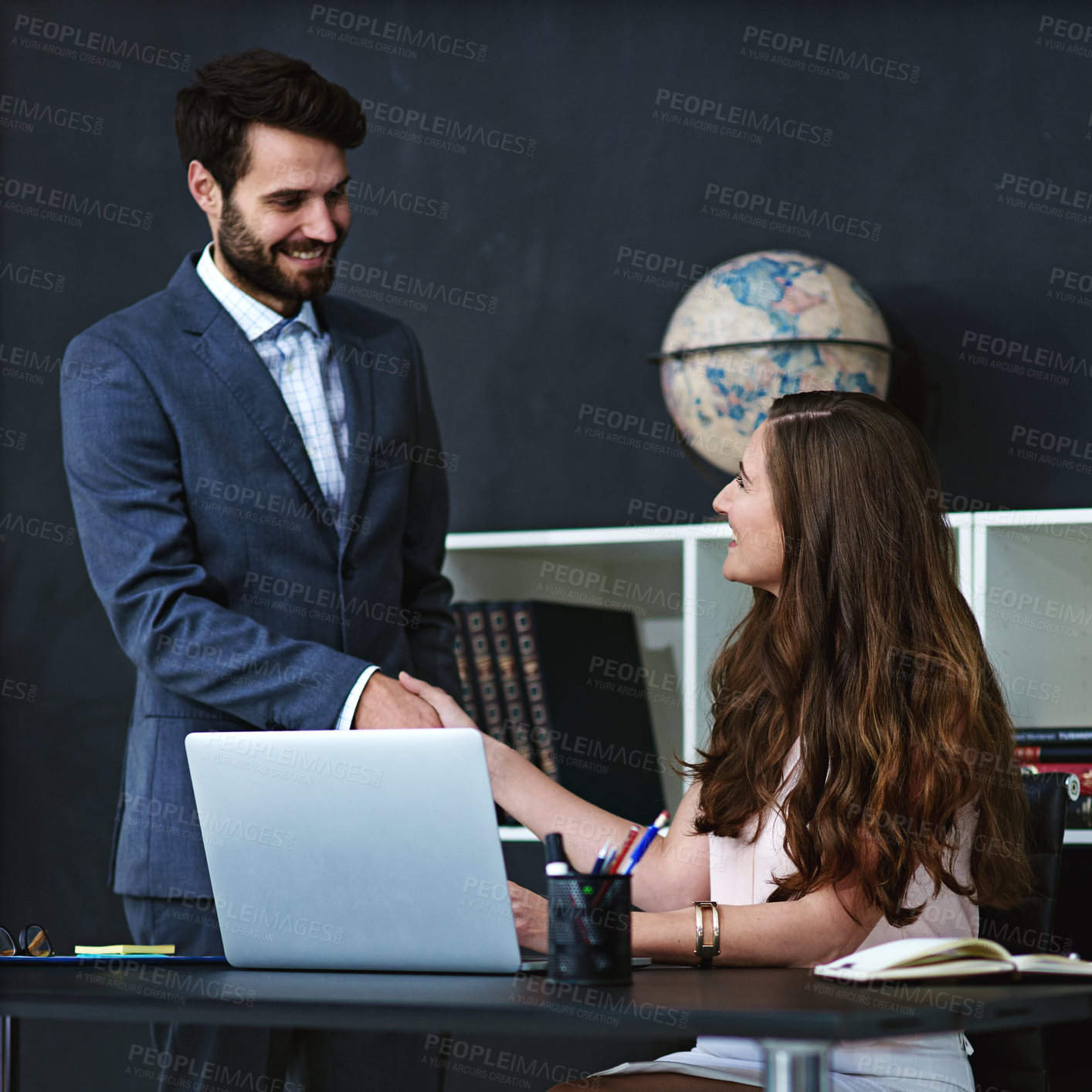 Buy stock photo Business people, laptop and meeting with handshake for partnership, agreement or b2b deal at office. Happy businessman shaking hands with employee or colleague for teamwork or greeting at workplace