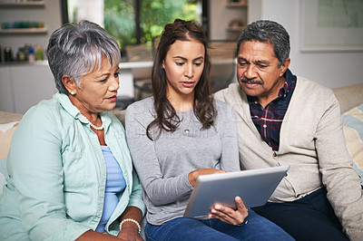 Buy stock photo Senior parent, woman and tablet in living room for connection or bonding with technology. Family, home and mature people with young, female person and happy for togetherness on couch in community
