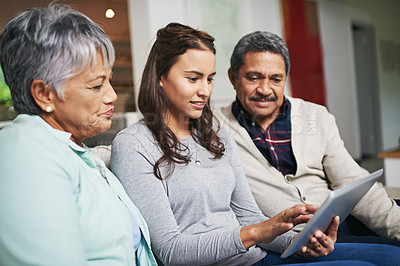 Buy stock photo Senior parents, woman and tablet in living room for connection or bonding with technology. Family, home and mature people with young, female person and happy for togetherness on couch in community