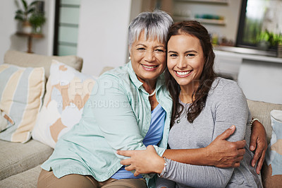 Buy stock photo Mother, smiles and hugs woman in home portrait for love, family or sharing moment together on sofa. People, happy and embrace in living room couch for bonding, connection and relationship growth