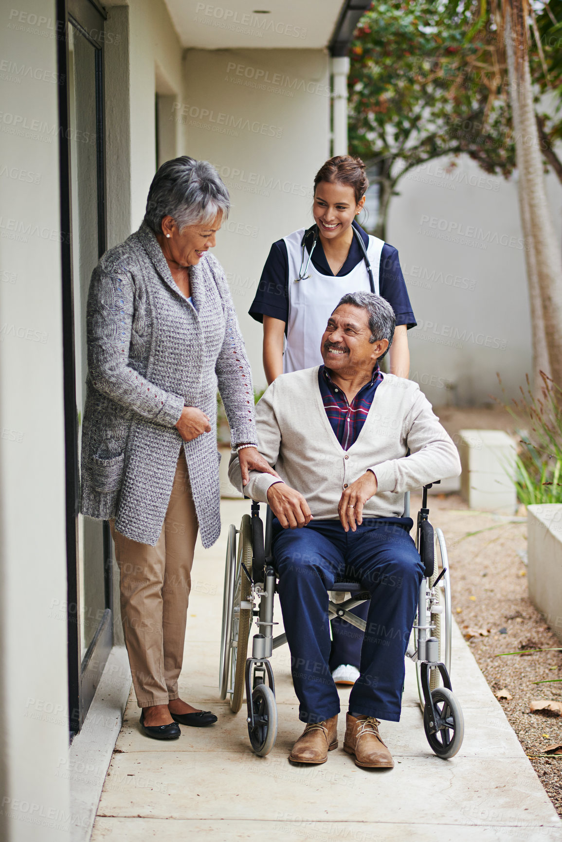 Buy stock photo Shot of a senior woman and her husband with a nurse at a retirement home