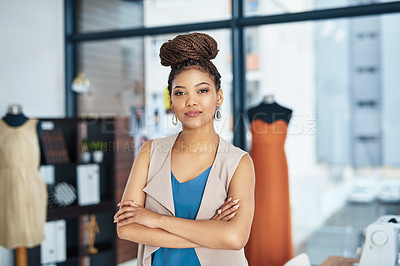 Buy stock photo Portrait of a young fashion designer posing with her arms crossed in her workshop