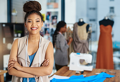 Buy stock photo Shot of a young fashion designer posing in her workshop