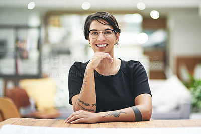 Buy stock photo Design, portrait and smile with woman at desk in office for artistic or creative occupation. Company, glasses and wooden table with happy young designer in workplace for start of career or project