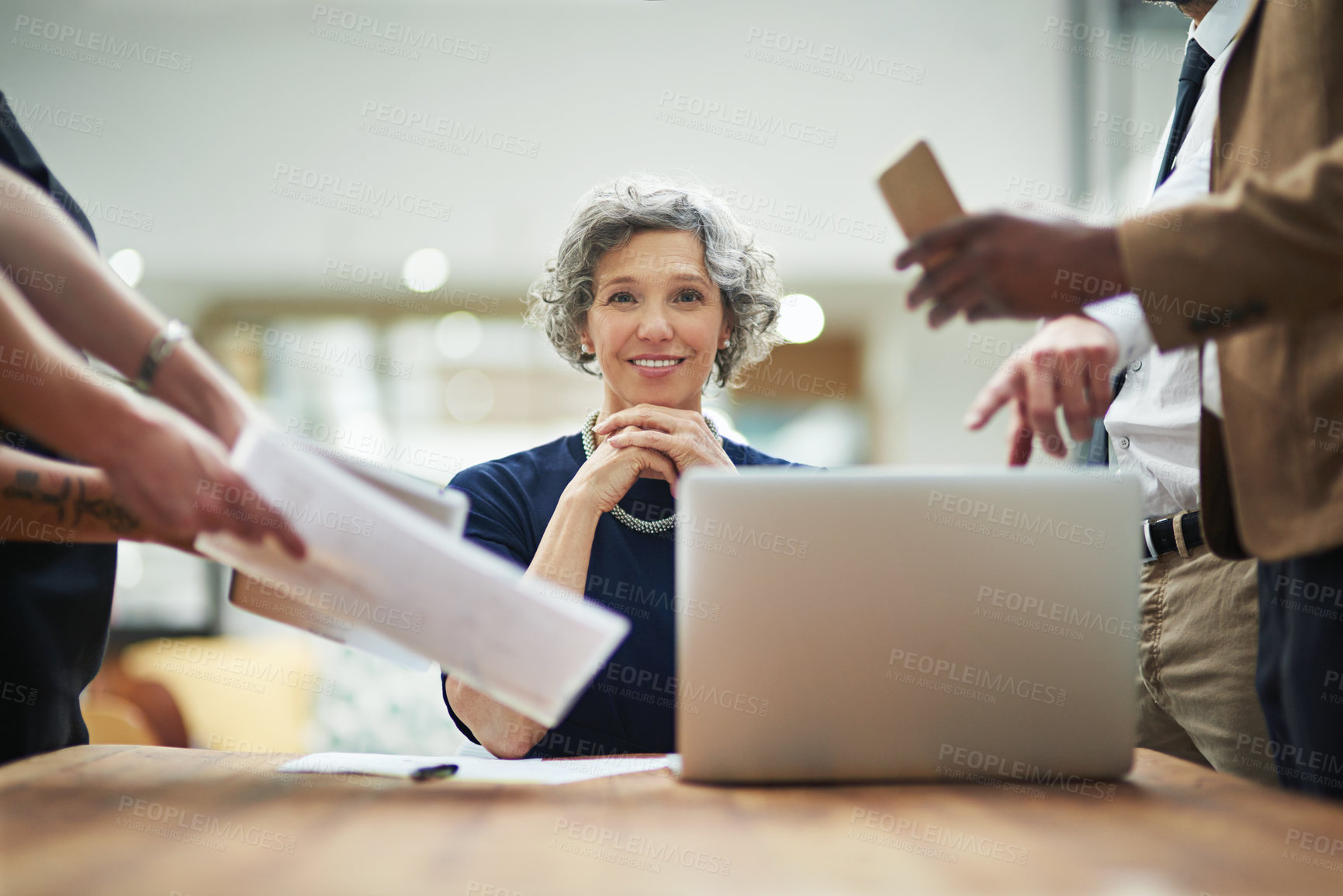 Buy stock photo Portrait, woman and laptop with multitasking in team with smile for business, workplace and company. Mature female, coworkers and busy for time management, job or career as project manager on account