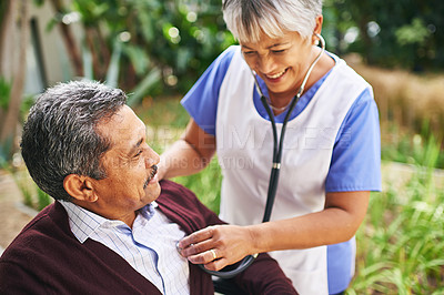 Buy stock photo Cropped shot of a senior man being cared for by a nurse at a retirement home