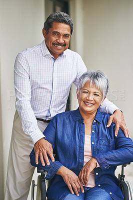 Buy stock photo Portrait of a senior man pushing his wife in a wheelchair outside