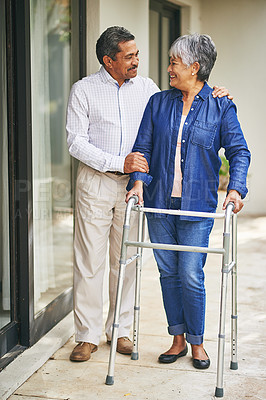 Buy stock photo Couple, happy man and senior woman with walker in backyard for care, love or bonding. Retirement, male pensioner and elderly female person with disability for support, embrace or morning walk 