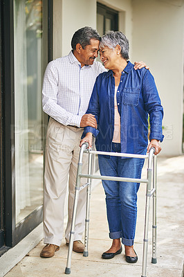 Buy stock photo Couple, happy man and elderly woman with walker in backyard for care, love or bonding . Retirement, male pensioner and senior female person with disability for support, embrace or morning walk