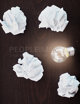 Buy stock photo Paper, draft and lightbulb in desk, inspiration and ideas for business, above and planning for work. Brainstorming, creativity and wood for background, table and strategy for company, project and job