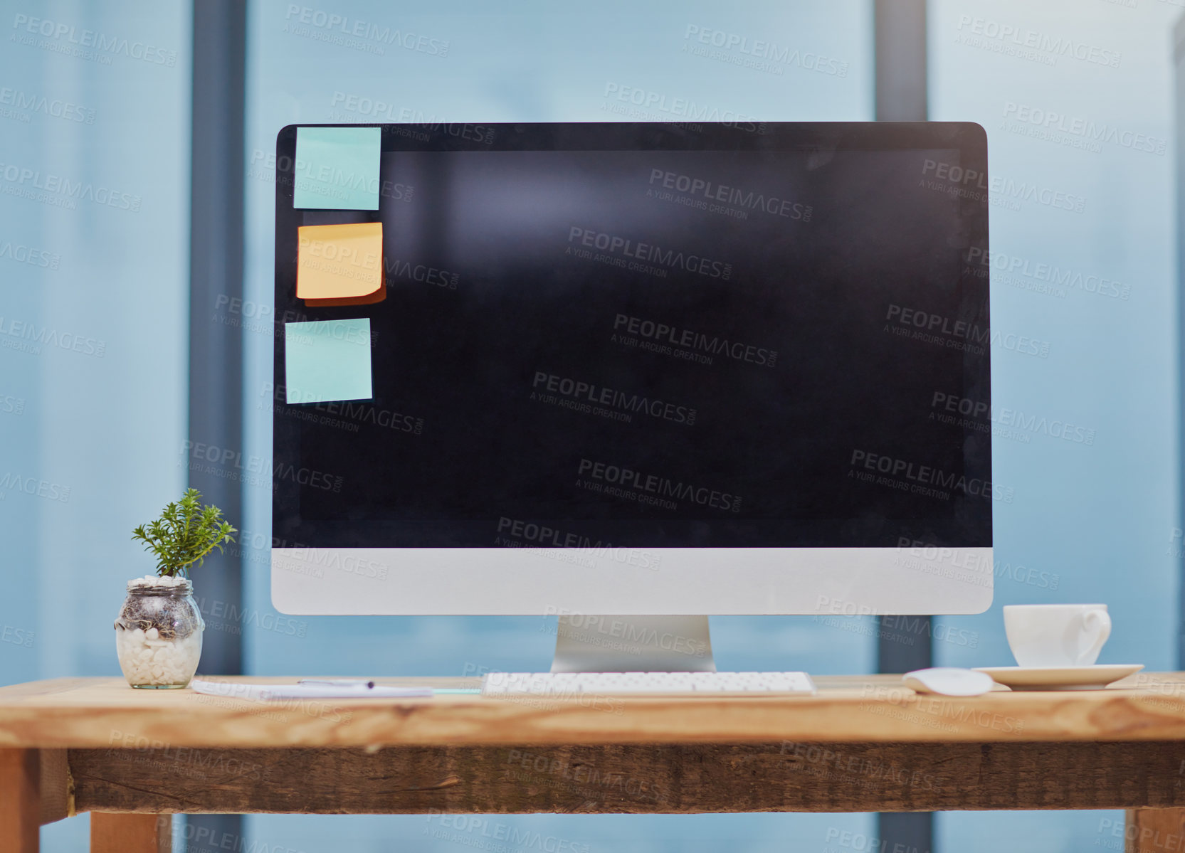 Buy stock photo Still life shot of a computer at a workstation in an office