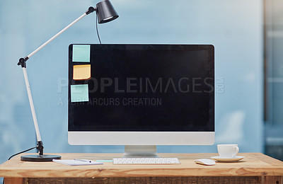 Buy stock photo Computer, desk and workspace light in office with mockup space, sticky notes and coffee for productivity. Interior, tech and notebook with plants at empty workplace for business and marketing screen