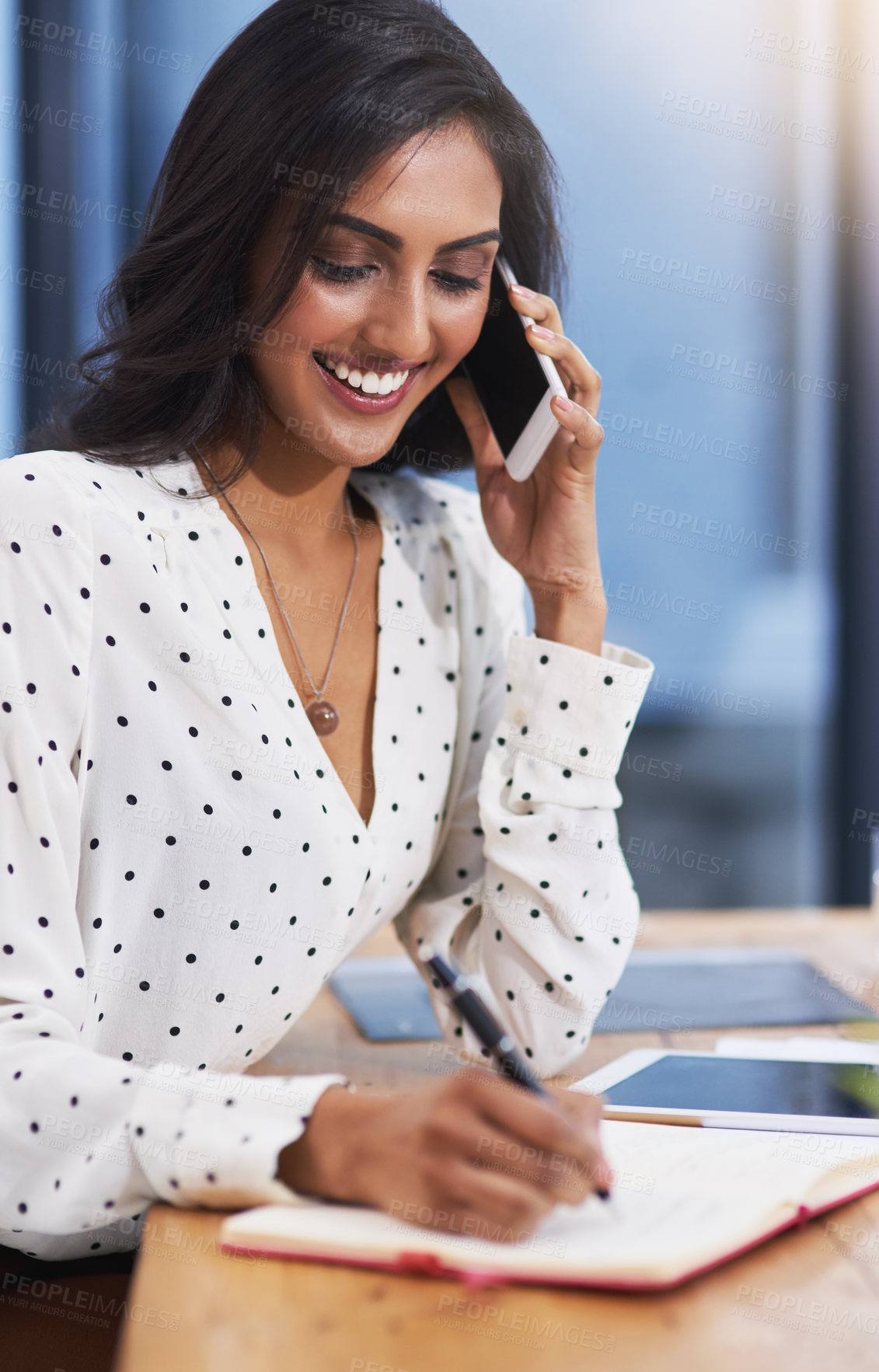 Buy stock photo Woman, talking on cellphone and smile in office for career, company planning and project management with diary and tablet. Journalist or editor and happy for job in organisation profession workspace
