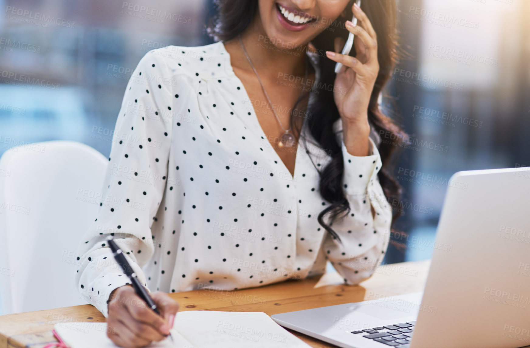 Buy stock photo Indian woman, writing and notebook in workplace on phone for e commerce, planning and networking for company. Graphic designer, technology and creative in office for digital, marketing and ideas.
