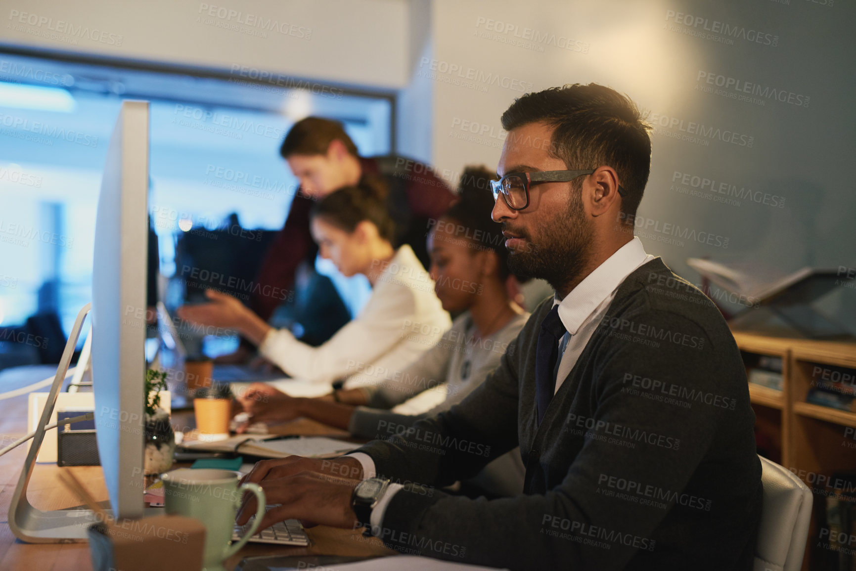Buy stock photo Business man, coder and computer at night in office, online and software or web design. Male person, coworking space and typing for deadline on project, cybersecurity and app developer in profile