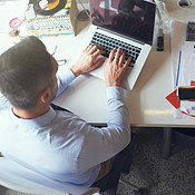 Working on his latest designs | Buy Stock Photo on PeopleImages ...