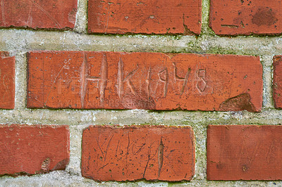 Buy stock photo Letters, writing and scratch on brick wall of building in city for background, pattern and exterior design. Construction, architecture and closeup of words or texture on stone, concrete and cement