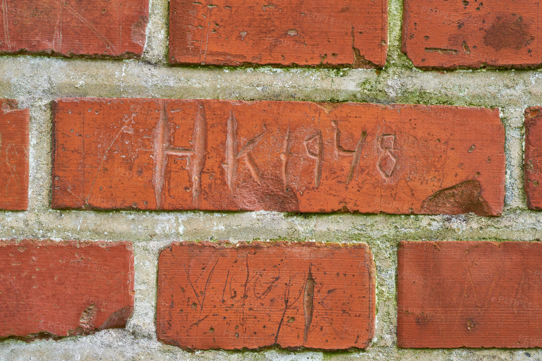 Buy stock photo Letters, writing and scratch on brick wall of building in city for background, pattern and exterior design. Construction, architecture and closeup of words or texture on stone, concrete and cement