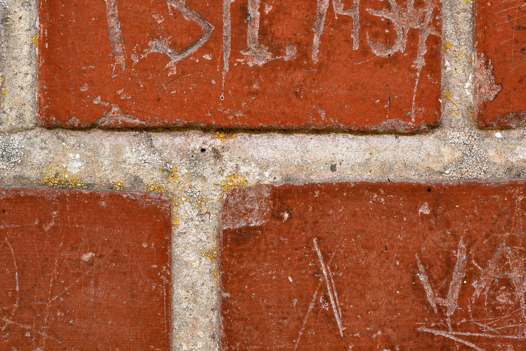 Buy stock photo Closeup, writing and scratch on brick wall of building in city for background, pattern and exterior design. Construction, architecture and graffiti, words or texture on stone, concrete and cement