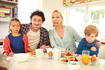 Buy stock photo Family, portrait and funny face with children in kitchen for silly, comic and bonding together. Food, happy mother and father with young kids for breakfast, nutrition and healthy meal in home