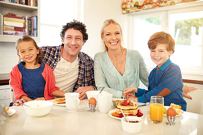 Buy stock photo Family, portrait and breakfast in house kitchen for happy, pancakes and nutrition with plate, knife and fork. Dad, mother and kids in home at morning for love, brunch and health with fruit by table