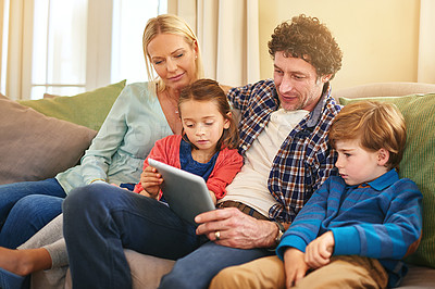 Buy stock photo Family, tablet and together on couch for watching with happiness, internet connection and rapport. Parents, young children and tech on sofa in living room for streaming with relax, online and smile