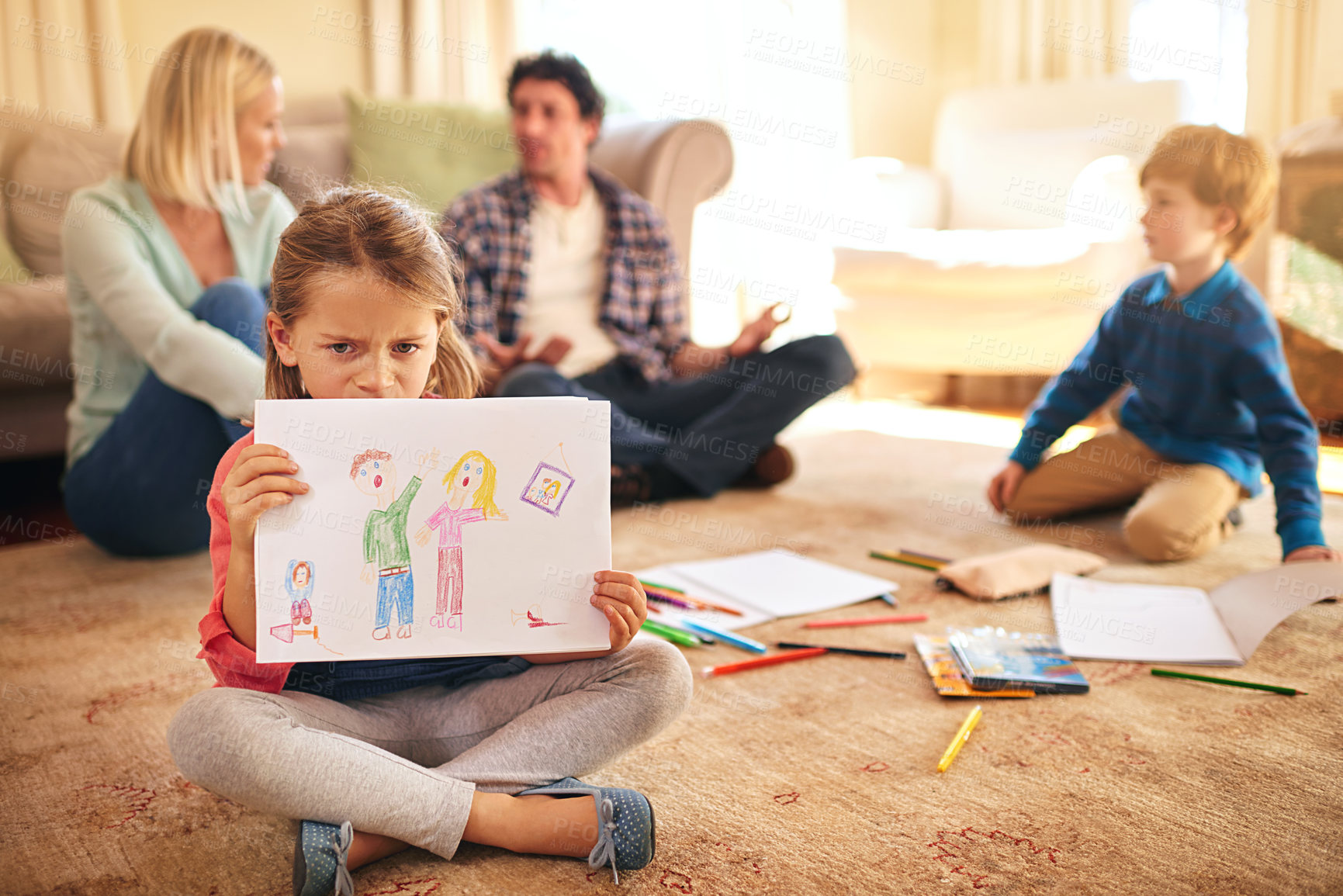 Buy stock photo Portrait of an unhappy daughter holding a drawing depicting domestic conflict