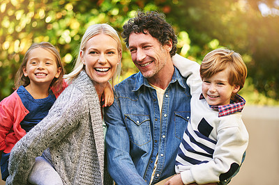 Buy stock photo Cropped shot of a happy family spending quality time together outside