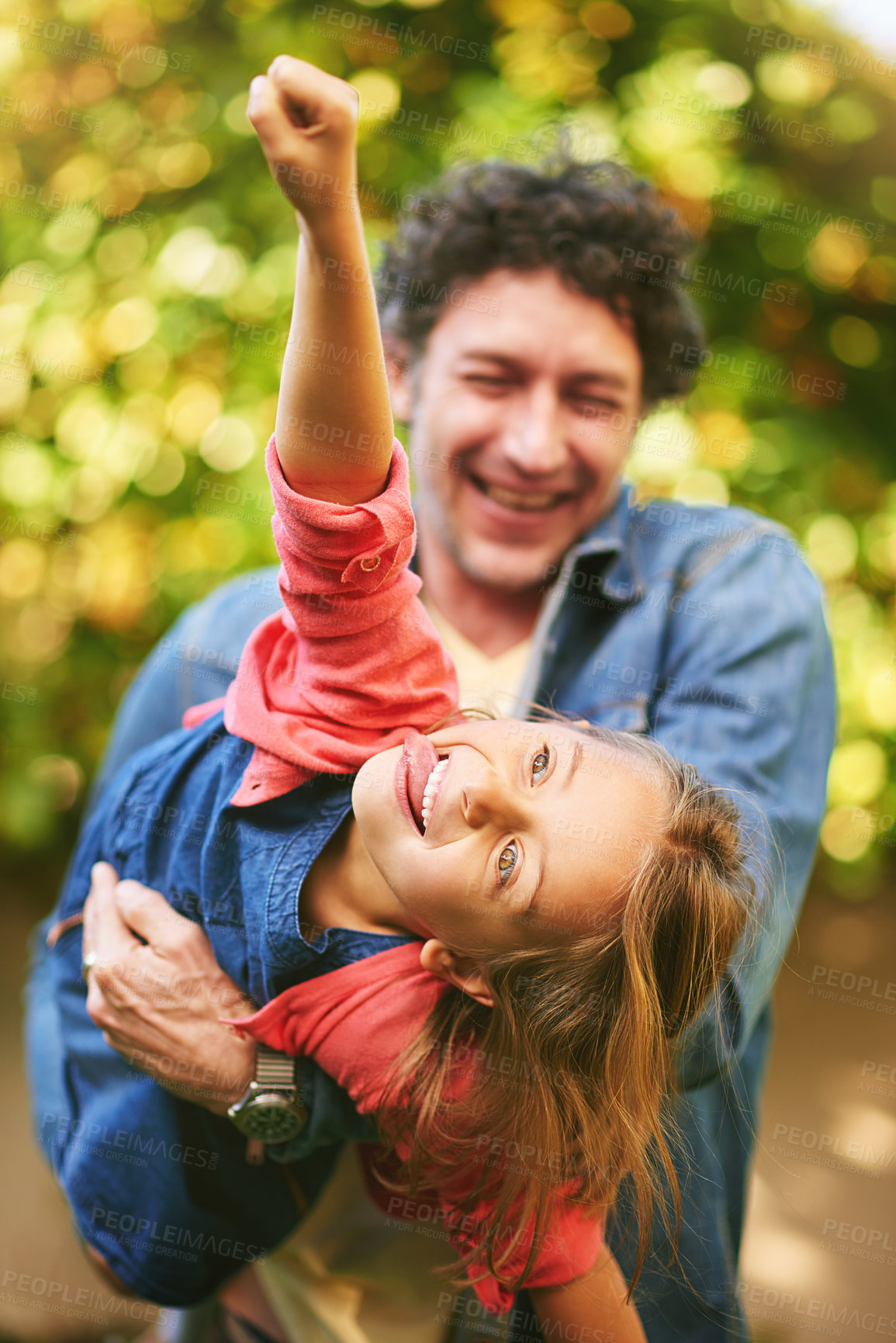 Buy stock photo Cropped shot of a father and daughter playing outdoors