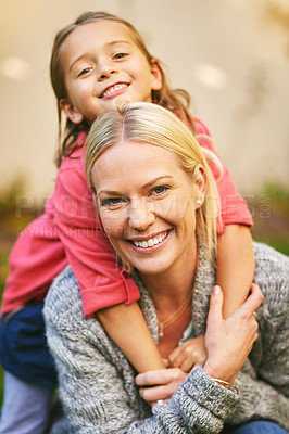 Buy stock photo Portrait of a mother and daughter spending quality time together outside