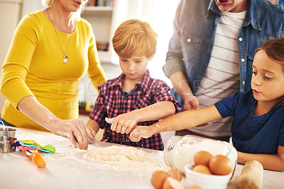 Buy stock photo Mother, father and children in kitchen baking cookies for learning, development and bonding as family. Mom, dad and kids mixing ingredients for desserts, pastries or biscuits and cake together 