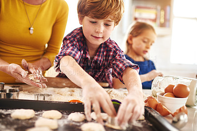 Buy stock photo Family, kitchen and baking for fun with learning with child development. Mom, kids and childhood on weekend for bonding with mess at home on table for memories with cookies, happy and children