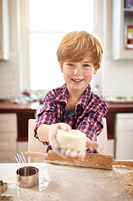 Buy stock photo Boy, dough and portrait in kitchen for baking, learning and fun for childhood on holiday indoor. Young child, smile and showing pastry for cookies and playful for adorable, children or happy innocent