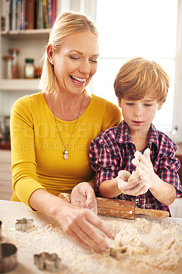 Buy stock photo Mother, son and baking with dough in kitchen for bonding, bread or donut or cake for family. Woman, boy child and cooking in home with love for food, ingredients or mixing for learning or development