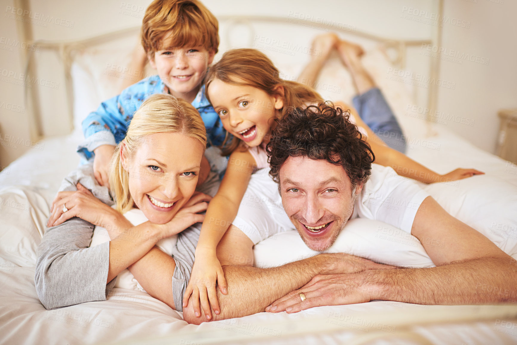 Buy stock photo Portrait of a happy family having some fun together in the morning at home
