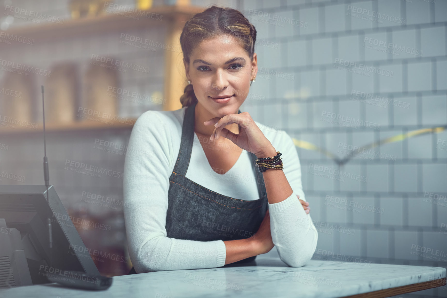 Buy stock photo Waitress, woman and portrait with smile in cafe for customer service, welcome and hospitality. Small business manager, cashier and happy by counter in coffee shop for assistance, help and reception