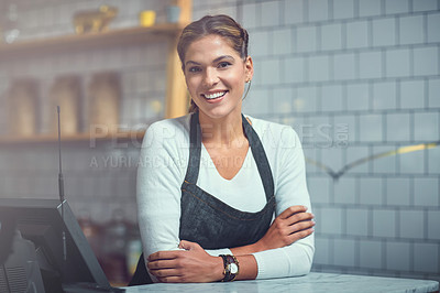 Buy stock photo Portrait of a young woman working behind the counter of her store