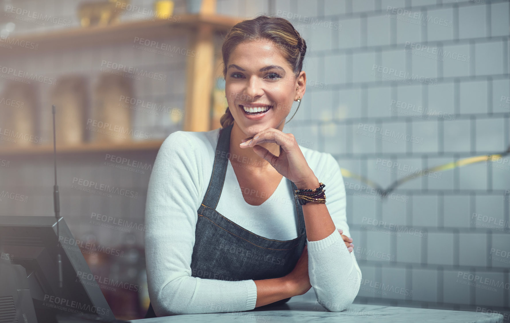 Buy stock photo Portrait of a young woman working behind the counter of her store