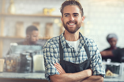 Buy stock photo Shot of a confident young man working in his store