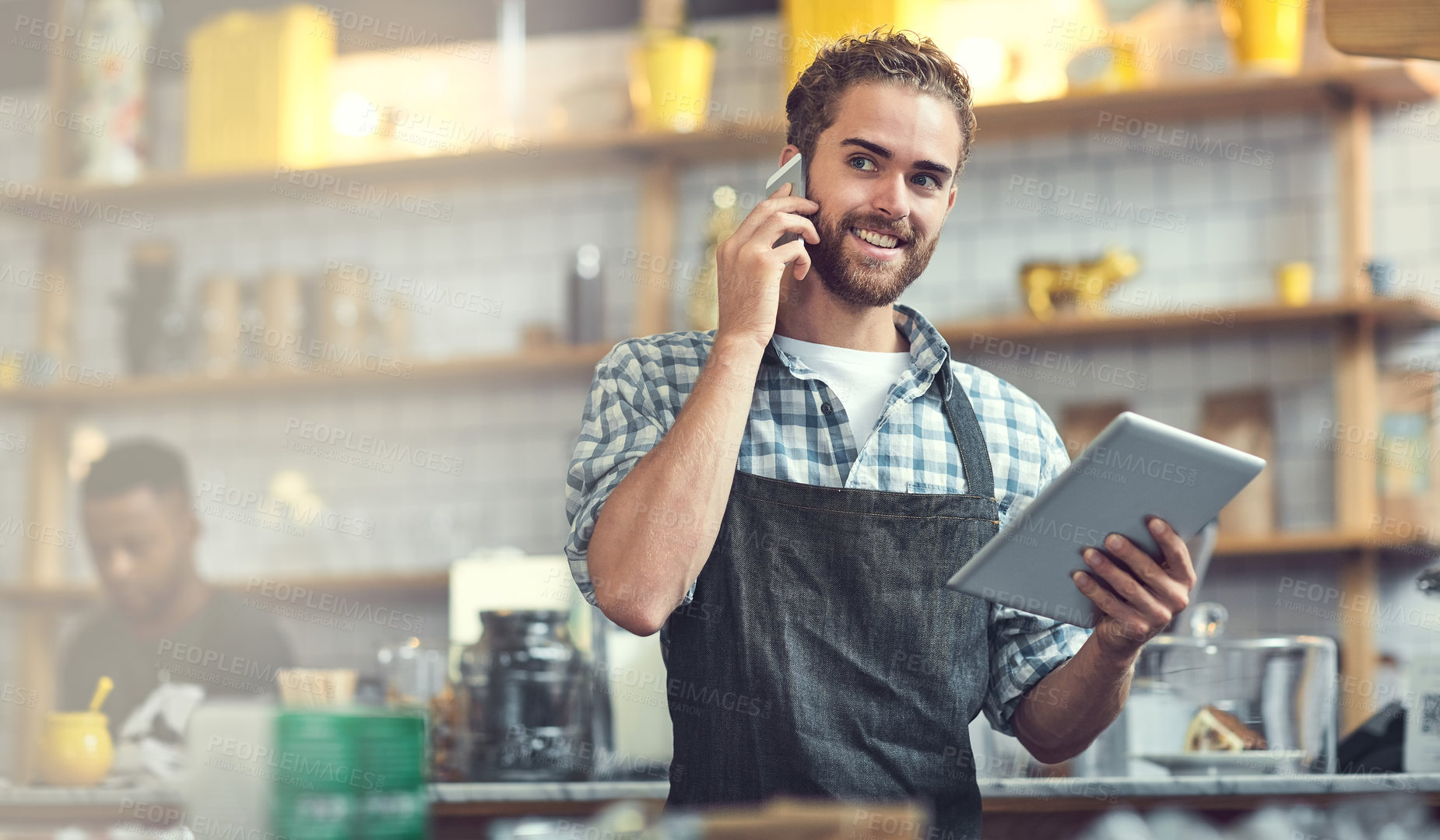 Buy stock photo Happy man, barista or phone call with tablet at cafe for small business, reservation or conversation. Young, male person or waiter smile with mobile smartphone or technology for booking at restaurant