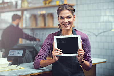 Buy stock photo Portrait of a young woman showing a blank screen on a digital tablet in her store