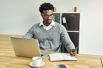 Buy stock photo Business, black man and writing in office with laptop for daily schedule or planning and goal setting for time management. Male employee, serious and digital technology with journal for research.