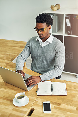 Buy stock photo Business, black man and typing in office with laptop or journal for daily schedule or planning for time management. Male entrepreneur, serious and notebook in workplace for ideas, thoughts and search