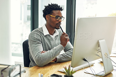 Buy stock photo Black man, computer and thinking in office, planning and website for research on article idea. Male person, journalist and brainstorming or online search for solution, ponder and reading feedback