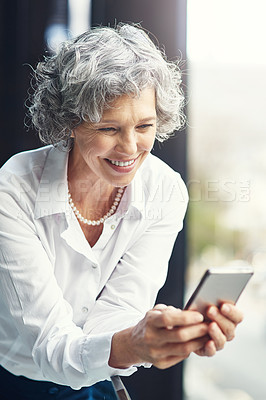 Buy stock photo Mature, business and woman and typing on smartphone, web search and internet browsing or mobile connection. Communication, technology and online laugh for meme on work break, happy for notification
