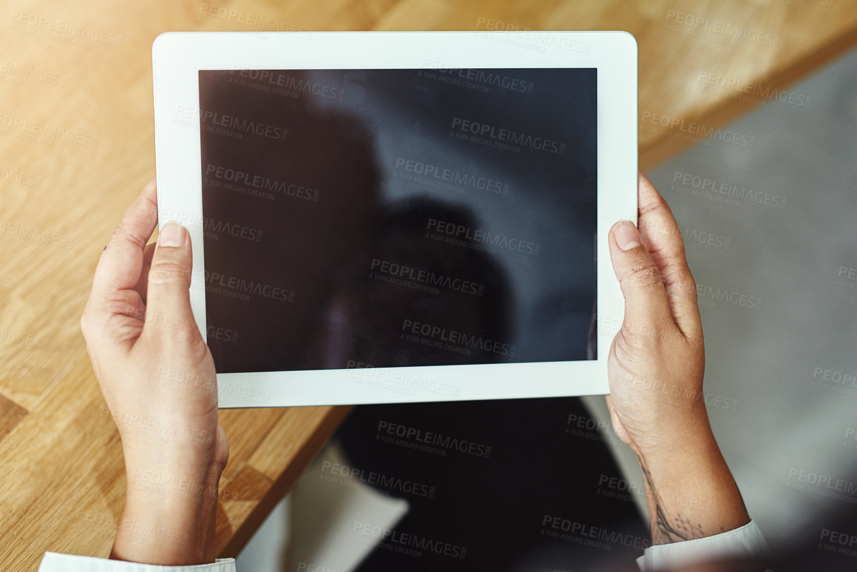 Buy stock photo Hands, tablet and screen with a business person working online in the office for information research. Technology, internet and display with a corporate employee accessing a database from above