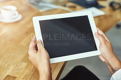 Buy stock photo Closeup shot of a person holding a digital tablet in a modern office
